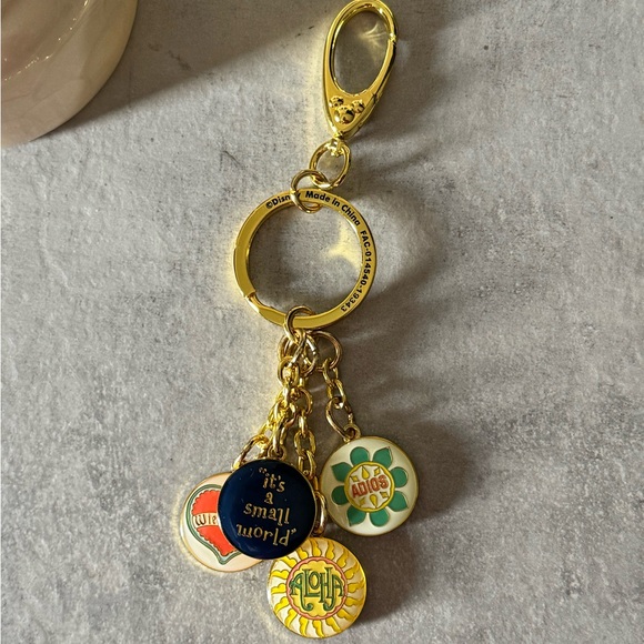 DISNEY It’s a small World Gold and Multicolor Keychain - Picture 1 of 3